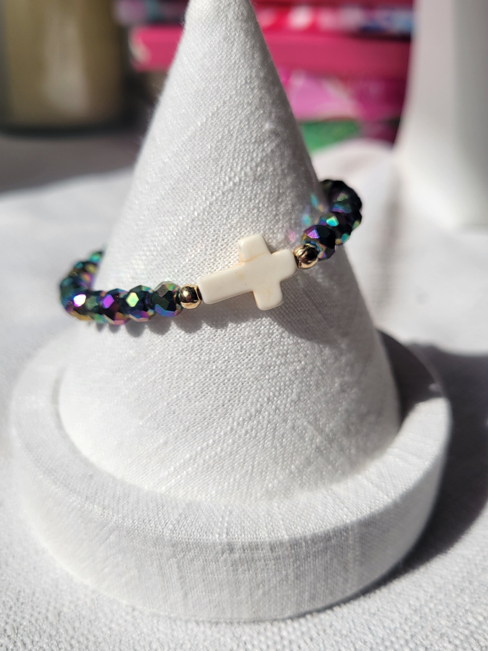 Iridescent Beaded Stretch Bracelet with a White Cross